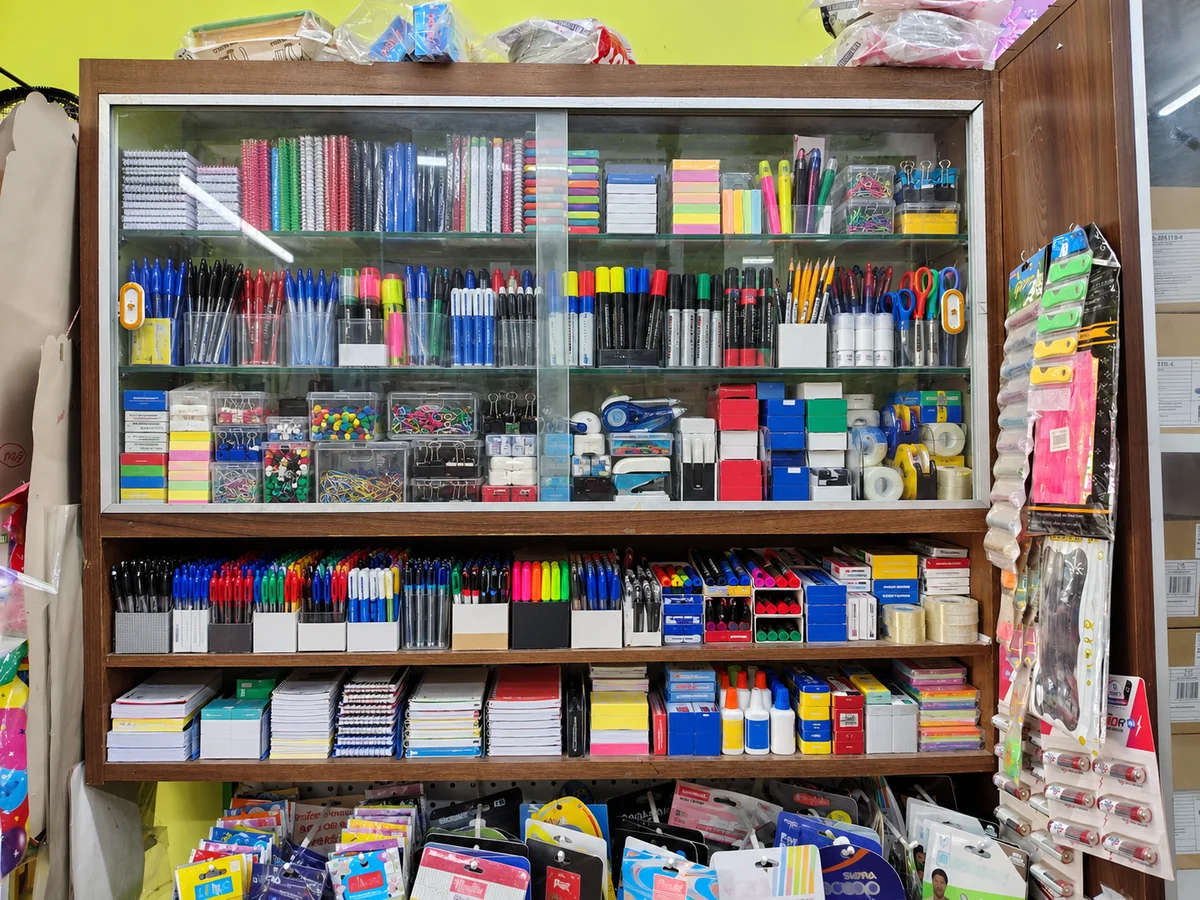 AI concept of a fuller stationery cabinet based on the shop, with pens, notebooks, markers and office supplies.